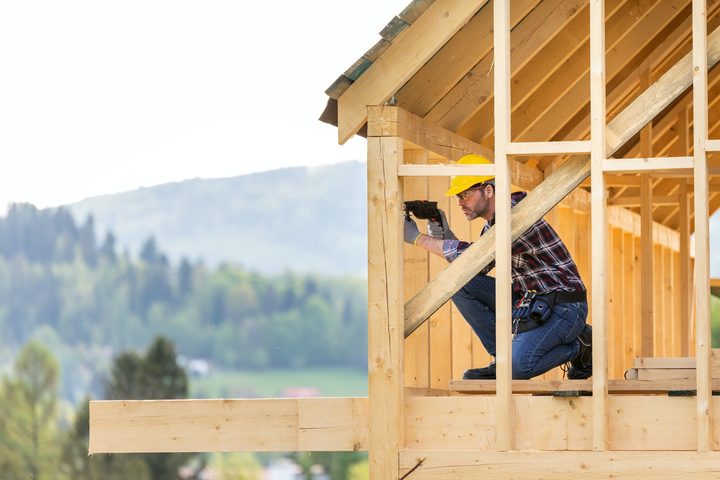 roofer-builder-working-on-roof-structure-at-construction-site.jpg